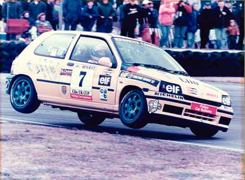 Cox in a Renault watched by onlookers